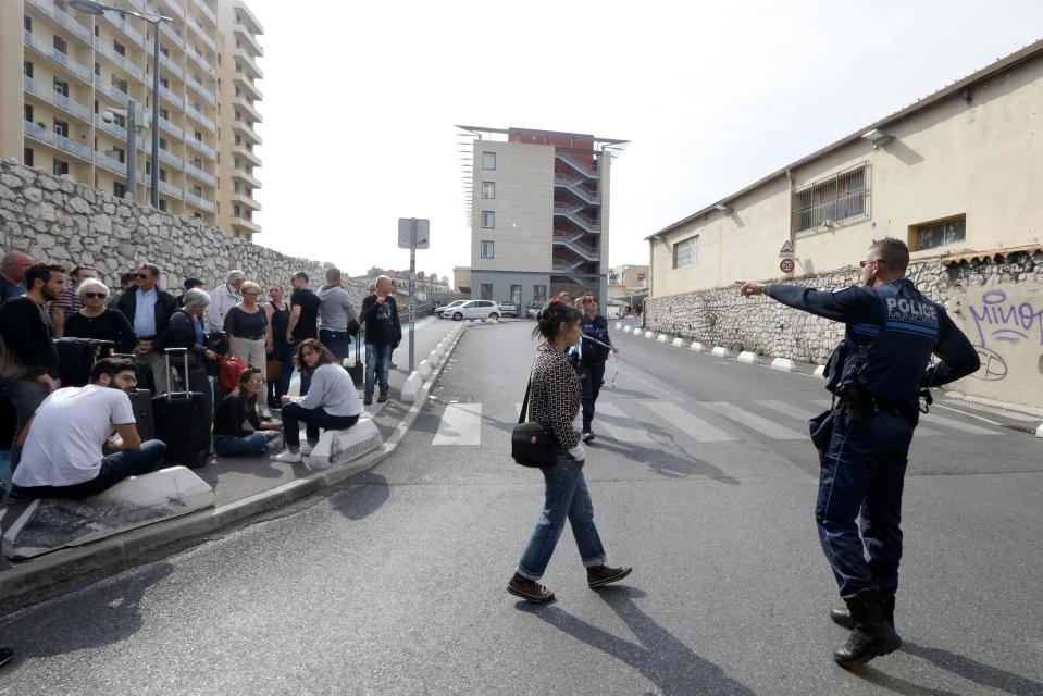  Police instruct bystanders to stay back from the scene of the brutal knife attack