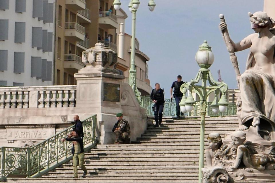  Armed police and soldiers lock down the area around the station