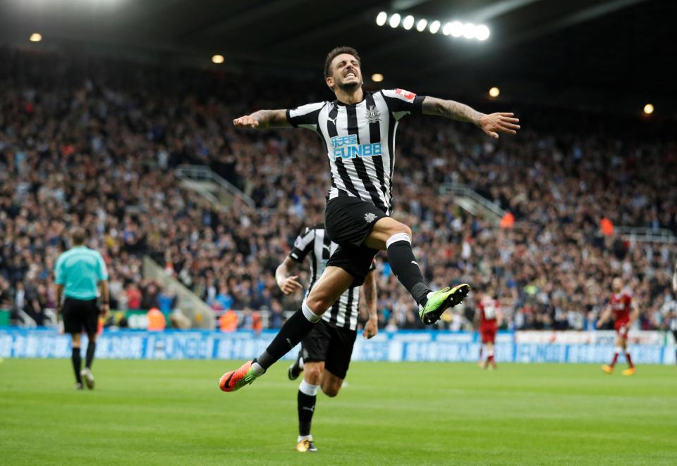  Joselu leaps in celebration after he scrambled in the equaliser for Newcastle against Liverpool