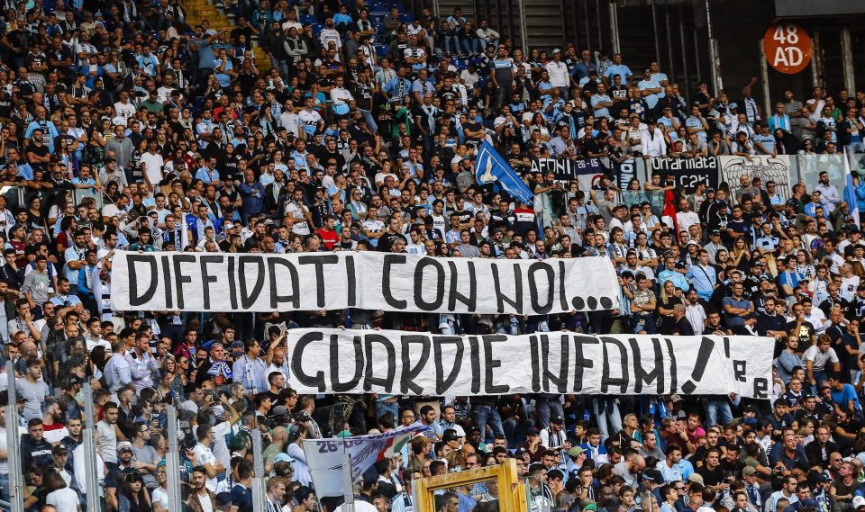  Lazio fans display a banner reading in Italian "Warned with us, cops infamous" during the Serie A soccer match with Sassuolo at the Olympic stadium on Sunday