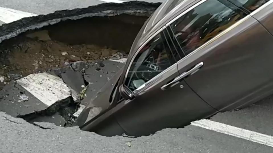  The six foot sinkhole appeared as the driver set off after a traffic light