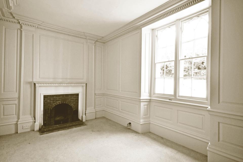  Light floods into this wood-panelled room through large windows