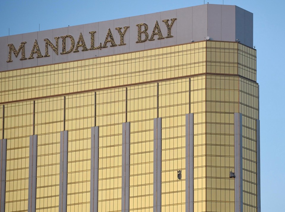 Broken windows are seen on the 32nd floor of the Mandalay Bay Resort 