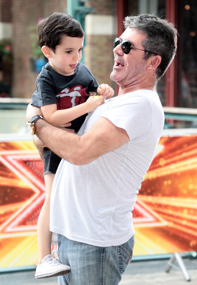  About that name... Simon, pictured with son, Eric, has teased Cheryl over the choice of 'Bear'