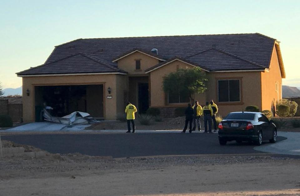  Cops are seen outside the killer's home in Mesquite, Nevada, today