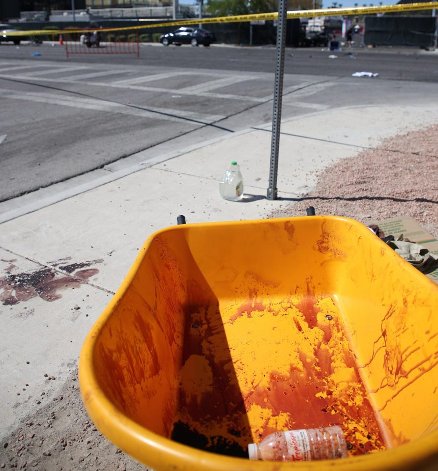  A bloody wheelbarrow used to ferry injured people to safety is seen in the street