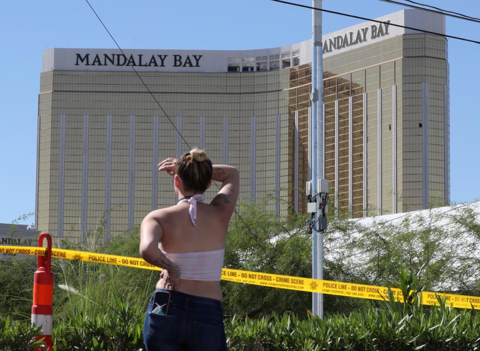  The Mandalay Bay can be seen behind a police cordon the day after the attack