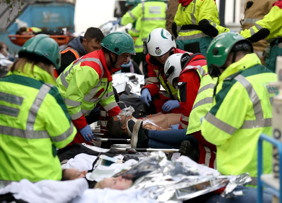 Doctors set up a makeshift field hospital to treat dozens of wounded, some played by real people and some by mannequins