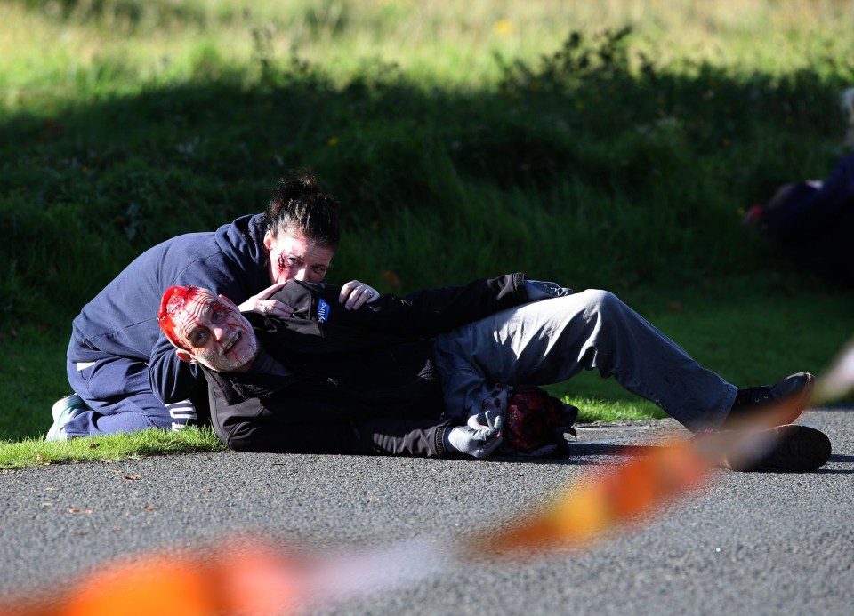 Gruesomely realistic makeup has been used on these volunteers playing victims of a terror attack in Edinburgh