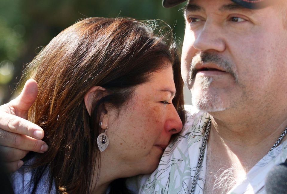  Sanchez comforts his girlfriend Johanna Ernst, who also survived the attack