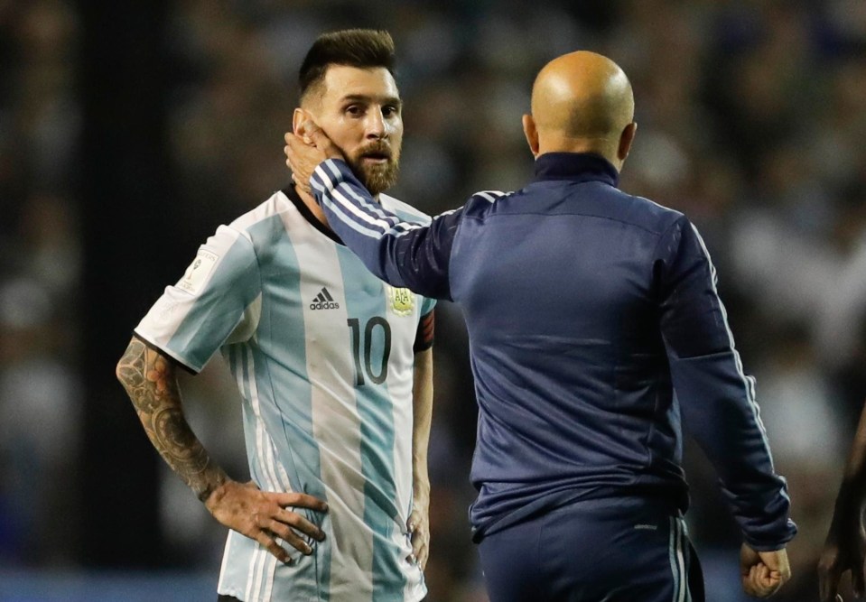 Lionel Messi is consoled by Jorge Sampaoli after the draw with Peru