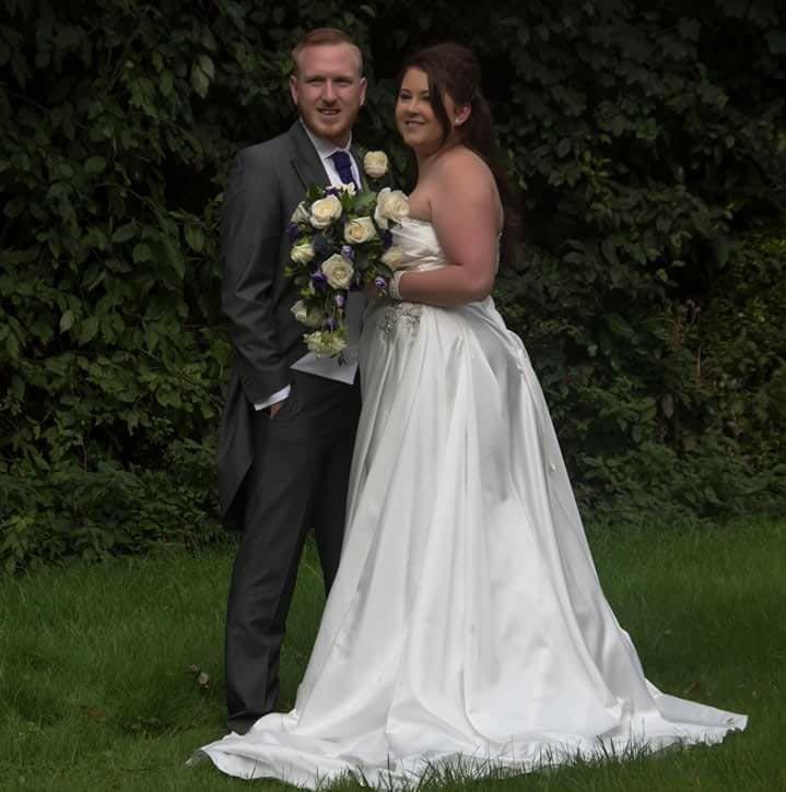  Newlyweds Rebecca and Paul Stewart, pictured on their wedding day, snapped the beast's fin on their Honeymoon