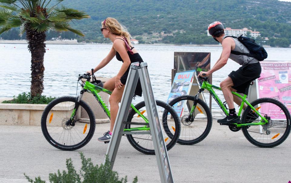  Matt and Lily were snapped riding matching bikes along the coast