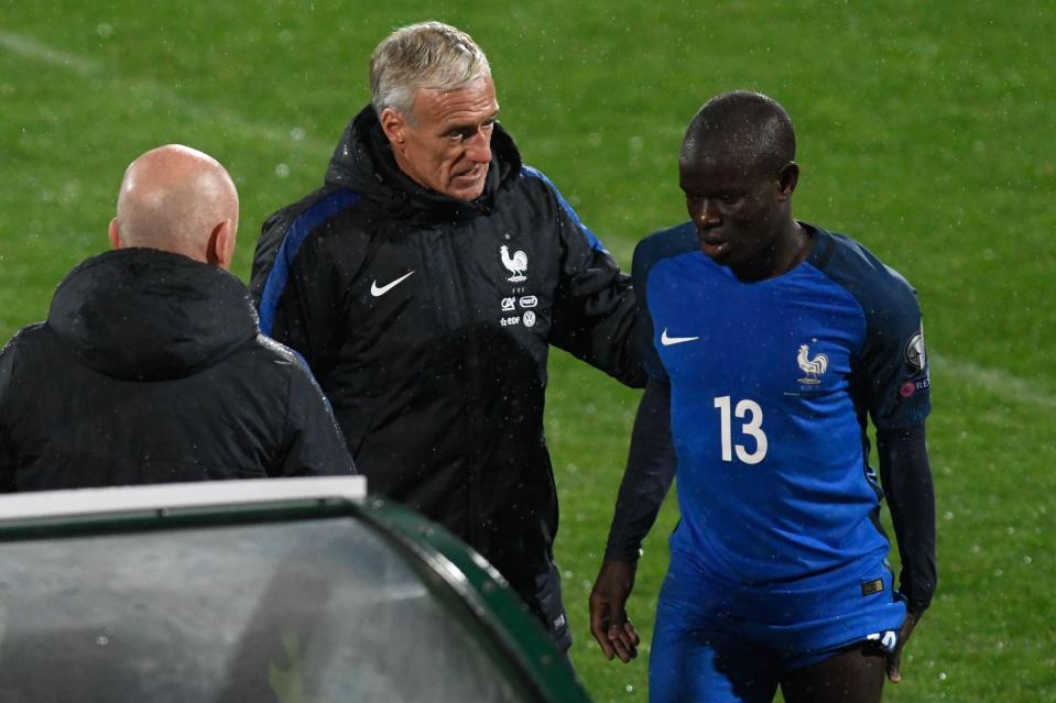  N'Golo Kante held the back of his leg as he left the pitch injured