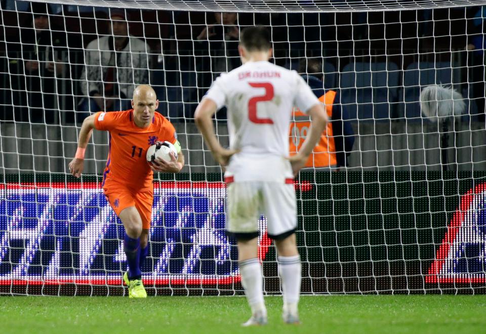  Arjen Robben races back to his own half after netting a penalty for Netherlands against Belarus