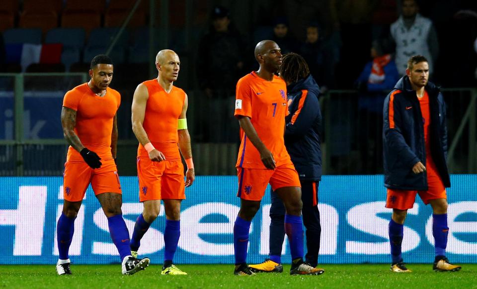  The Dutch players walk off the pitch at Borisov Arena after failing to close the goal difference on Sweden