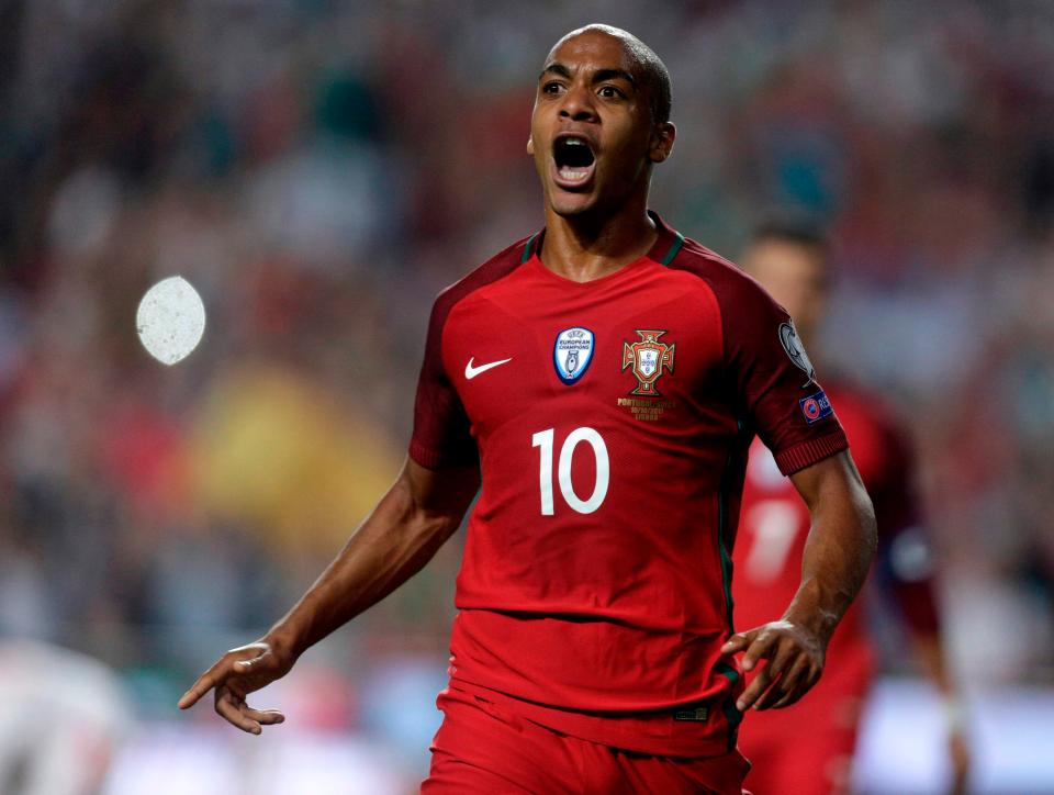  Joao Mario wheels away after he helped his Portugal side take the lead against Switzerland