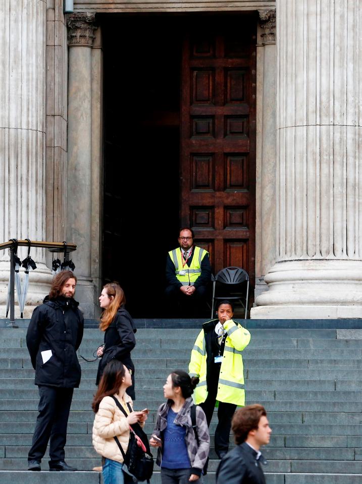  Guards stand outside the entrance to the iconic cathedral as police carried out investigations inside