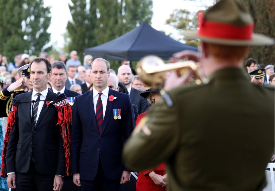  A bugle player performs in front of Prince William at Tyne Cot Cemetery