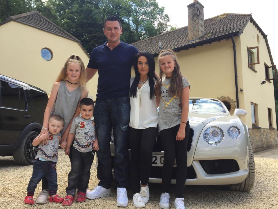  Matt and Moniqe outside their home with their Bentley