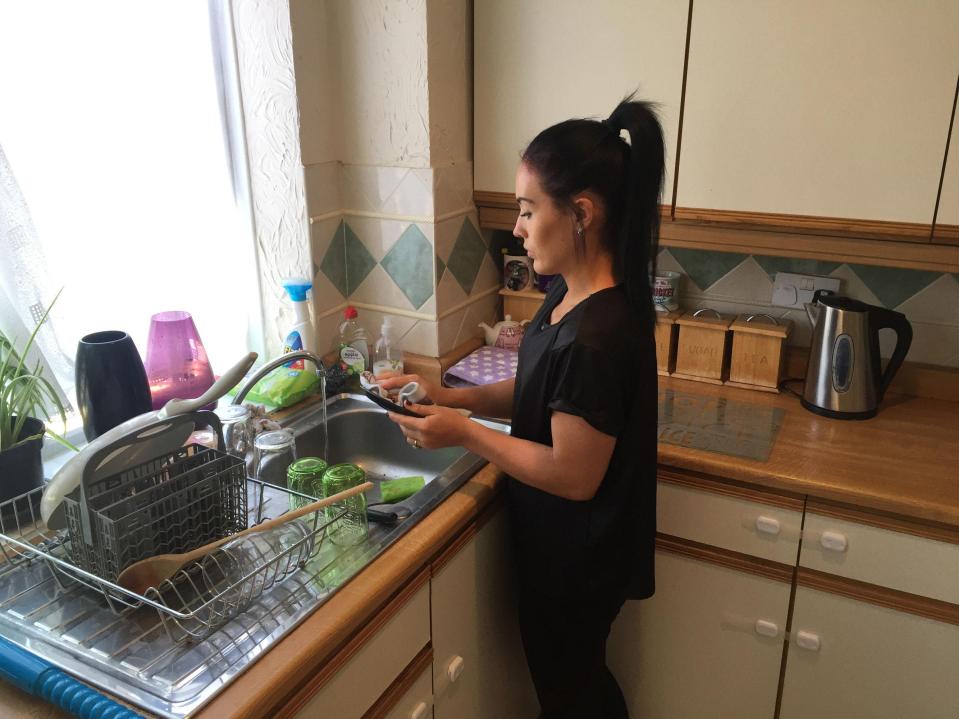  Moniqe washes up in the Leamons' kitchen