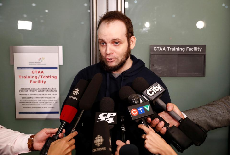  Joshua Boyle speaks to gathered media after arriving at Toronto Pearson International Airport