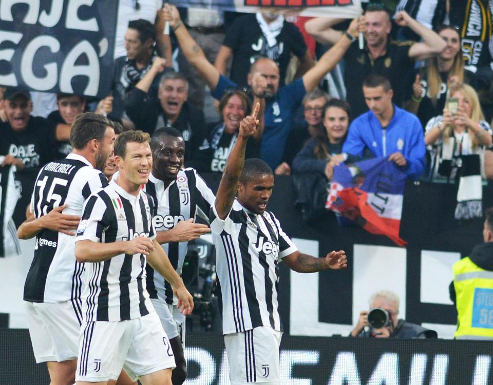  Douglas Costa celebrates his opening goal against the visitors