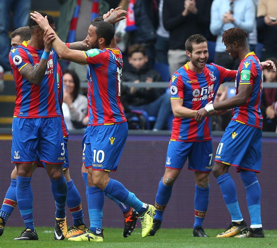  The Eagles celebrate as Wilfried Zaha clinches a 2-1 win over champions Chelsea