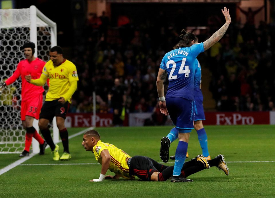  Richarlison tumbles under the challenge of Hector Bellerin for a spot-kick