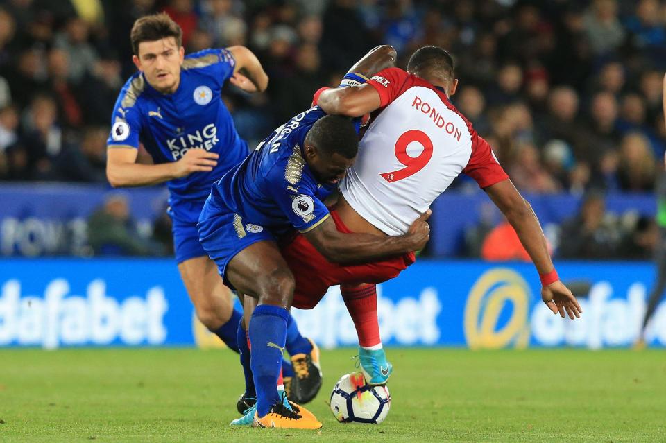  Wes Morgan vies with striker Salomon Rondon at the King Power Stadium