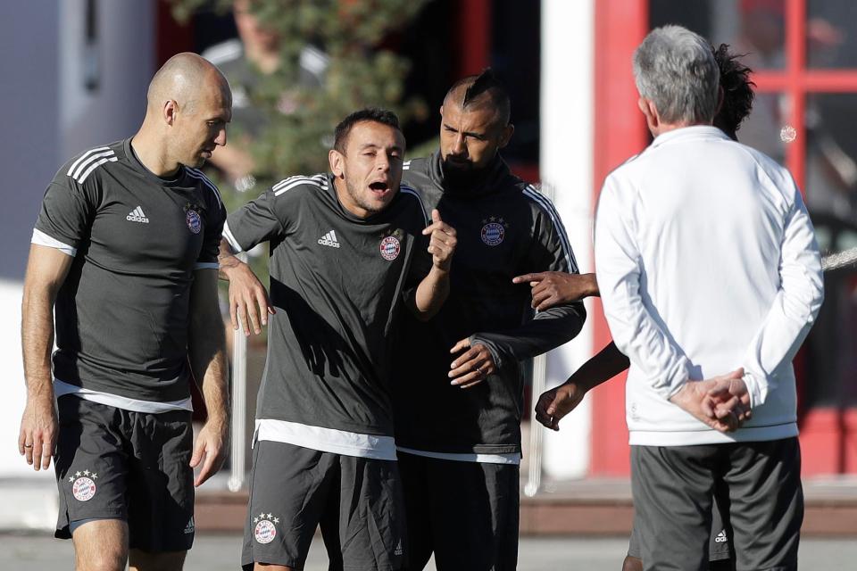  Bayern's team-mates share a joke in front of their 72-year-old boss