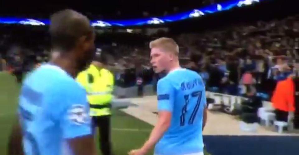  Kevin De Bruyne walks away after shouting at Fernandinho and David Silva