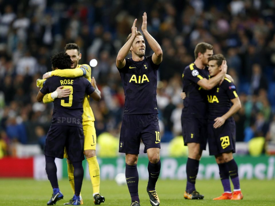  Kane applauds after drawing 1-1 with Madrid at the Bernabeu