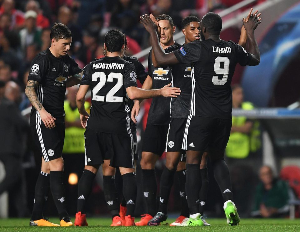  Marcus Rashford is congratulated by his Man Utd team-mates after scoring against Benfica