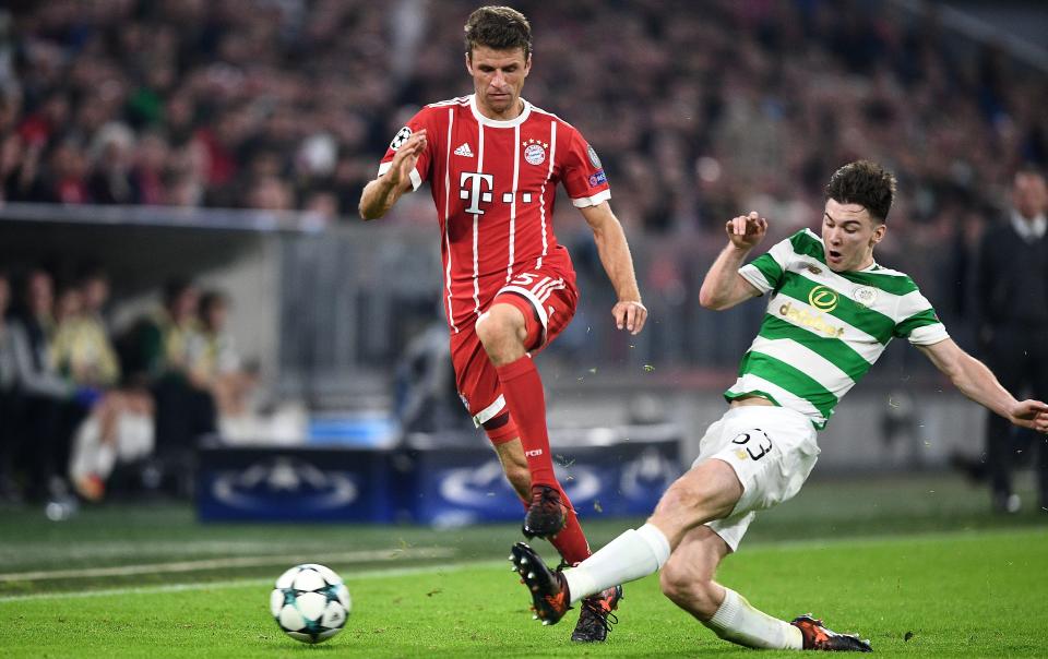  Tierney slides in on Thomas Mulller at the Allianz Arena