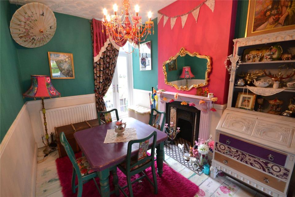 The dining room in the spacious Cardiff home is filled with vintage furniture and nick nacks