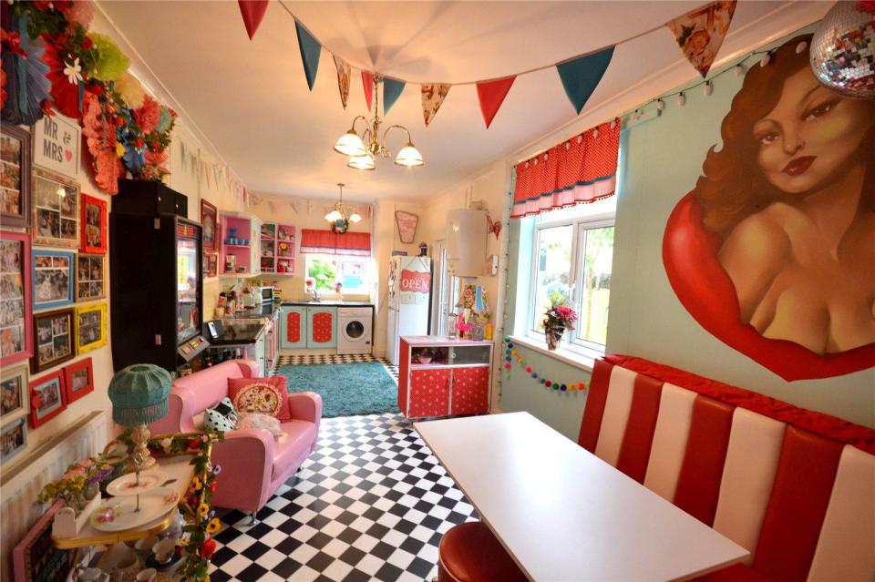 The kitchen has been designed to look like an American roadside diner, including the chequered flooring and booth seats