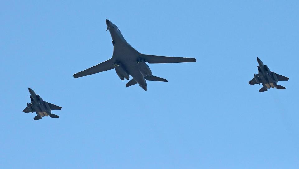  US Air Force B-1B bomber, centre, and two South Korean fighter jets F-15K fly over the Seoul Airport