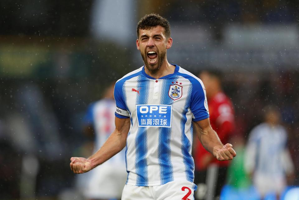 Huddersfield captain Tommy Smith led by example as Manchester United were despatched