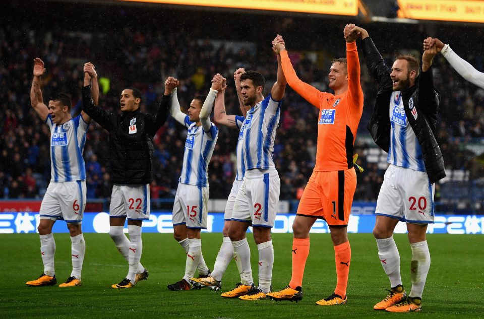  Huddersfield players celebrate after beating United at the John Smith's Stadium