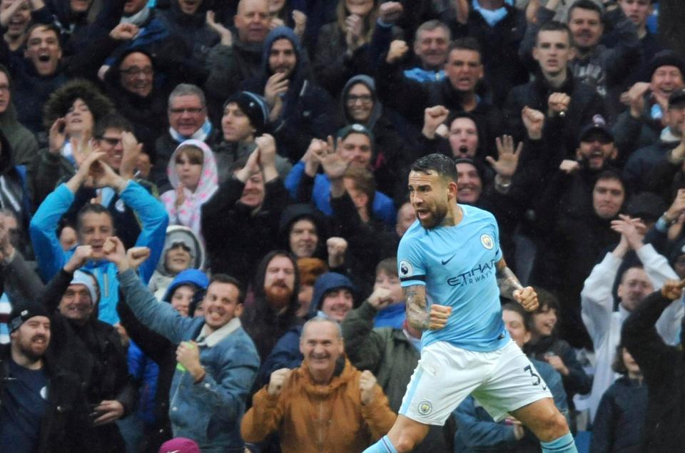 Manchester City's Nicholas Otamendi wheels away after scoring in a 3-0 win against Burnley