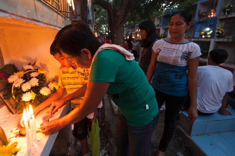  People light candles to mark All Saints' Day