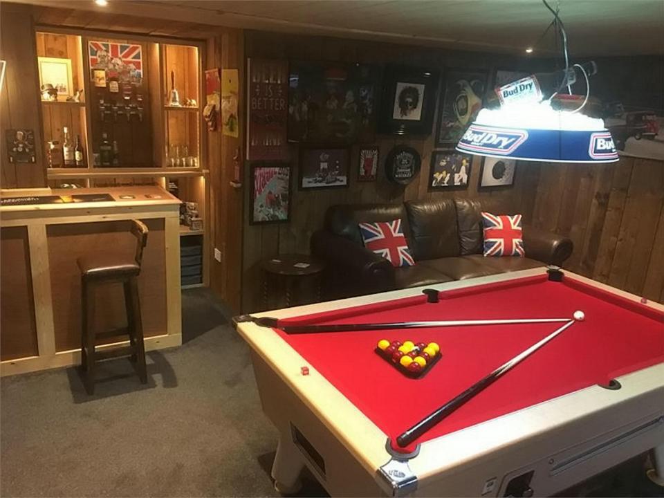  And in Cambridge, Ben Buey built an outside man cave with bar and chilling area called 'Wonky Donkey', which he named after a drawing his nine-year-old nephew gave him.