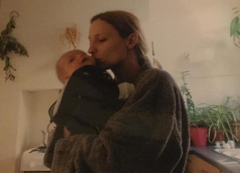  Debbie cradles and kisses son Noah when he was a baby