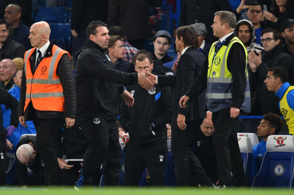  Antonio Conte and David Unsowrth embrace after the final whistle after a nervy end to the match