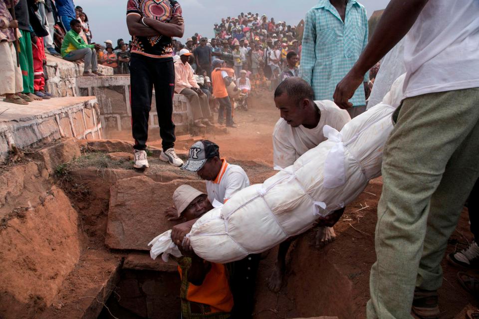  Madagascans have been told to stop the traditional practice of Famadihana - where locals dig up deceased relatives and dance with them before they are re-buried