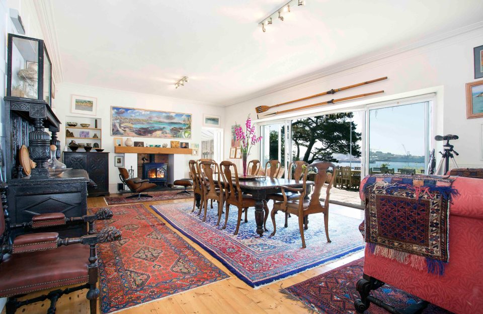 Huge patio doors at the rear of the dining room open out onto the stunning view of the idyllic harbour