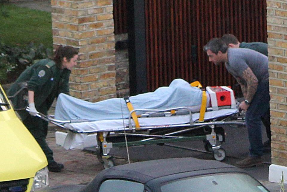  Our exclusive snap showed Simon being taken from his home on a stretcher after stairs tumble