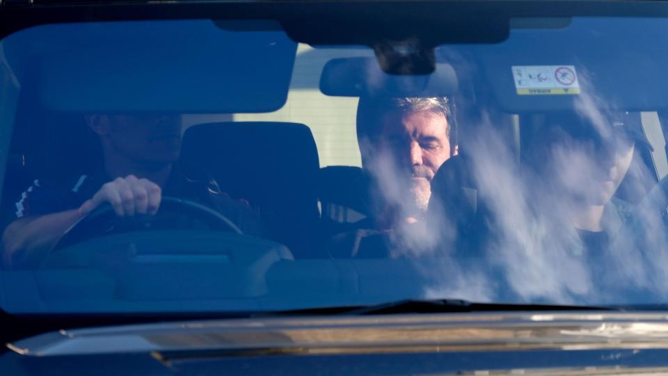  Simon Cowell pictured in a vehicle on his way home after the fall down stairs