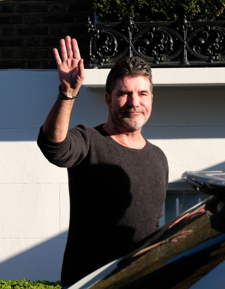 The X Factor boss put on a brave face for the cameras